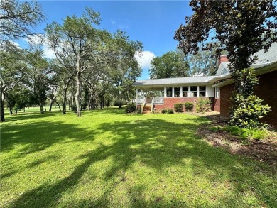 Imagine mornings on your spacious covered front porch or on Okefenokee Country Club in Georgia - for sale on GolfHomes.com, golf home, golf lot