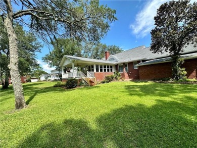 Imagine mornings on your spacious covered front porch or on Okefenokee Country Club in Georgia - for sale on GolfHomes.com, golf home, golf lot