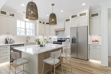 Experience refined coastal living at 387 Blossom Tree Lane SE on Carolina National Golf Club in North Carolina - for sale on GolfHomes.com, golf home, golf lot