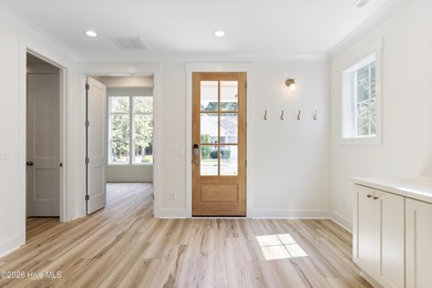 Experience refined coastal living at 387 Blossom Tree Lane SE on Carolina National Golf Club in North Carolina - for sale on GolfHomes.com, golf home, golf lot