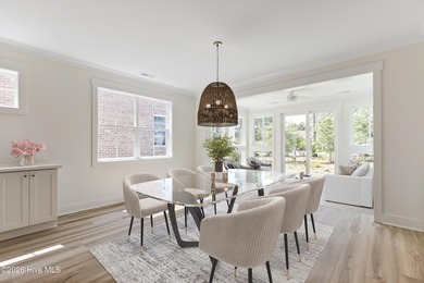 Experience refined coastal living at 387 Blossom Tree Lane SE on Carolina National Golf Club in North Carolina - for sale on GolfHomes.com, golf home, golf lot