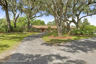 Located in the highly desirable Dogwood Estates golf course on Brooksville Country Club At Majestic Oaks in Florida - for sale on GolfHomes.com, golf home, golf lot