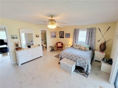 Meticulously maintained end unit with updated kitchen and baths on The American Golf Club in Florida - for sale on GolfHomes.com, golf home, golf lot