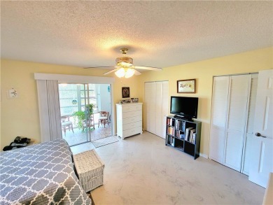 Meticulously maintained end unit with updated kitchen and baths on The American Golf Club in Florida - for sale on GolfHomes.com, golf home, golf lot