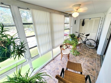 Meticulously maintained end unit with updated kitchen and baths on The American Golf Club in Florida - for sale on GolfHomes.com, golf home, golf lot