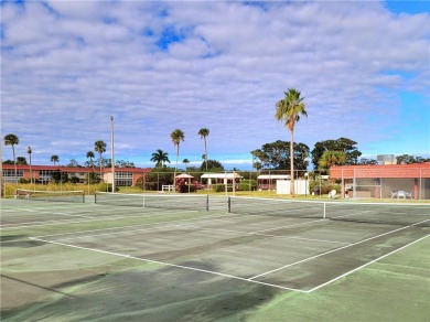 Meticulously maintained end unit with updated kitchen and baths on The American Golf Club in Florida - for sale on GolfHomes.com, golf home, golf lot