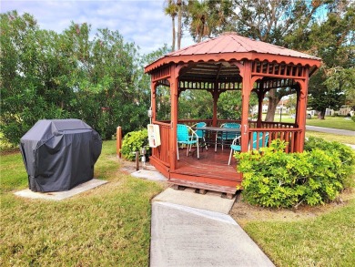 Meticulously maintained end unit with updated kitchen and baths on The American Golf Club in Florida - for sale on GolfHomes.com, golf home, golf lot