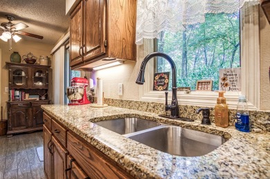 Enjoy the serenity and beauty of the forest from the deck of on Cortez Golf Course in Arkansas - for sale on GolfHomes.com, golf home, golf lot