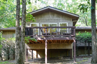 Enjoy the serenity and beauty of the forest from the deck of on Cortez Golf Course in Arkansas - for sale on GolfHomes.com, golf home, golf lot