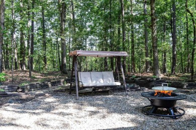 Enjoy the serenity and beauty of the forest from the deck of on Cortez Golf Course in Arkansas - for sale on GolfHomes.com, golf home, golf lot