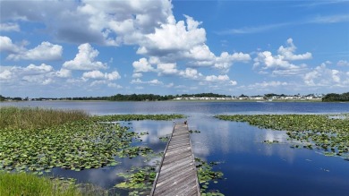 This prime .46-acre canal-front lot is located in the serene on River Greens Golf Course in Florida - for sale on GolfHomes.com, golf home, golf lot