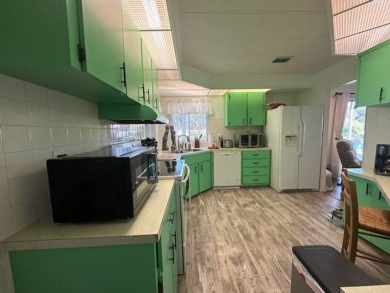 Turnkey 2-Bedroom, 2-Bath Home with Breathtaking Lake Views in on Vista Plantation Golf Club in Florida - for sale on GolfHomes.com, golf home, golf lot
