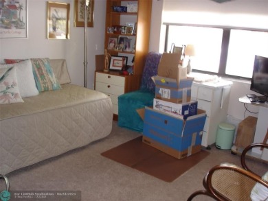 This 1st floor inside corner condo has an assigned parking spot on Sunrise Lakes Phase IV Golf Course in Florida - for sale on GolfHomes.com, golf home, golf lot