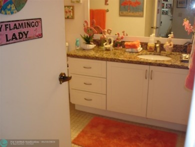 This 1st floor inside corner condo has an assigned parking spot on Sunrise Lakes Phase IV Golf Course in Florida - for sale on GolfHomes.com, golf home, golf lot