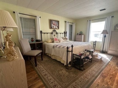 Turnkey 2-Bedroom, 2-Bath Home with Breathtaking Lake Views in on Vista Plantation Golf Club in Florida - for sale on GolfHomes.com, golf home, golf lot