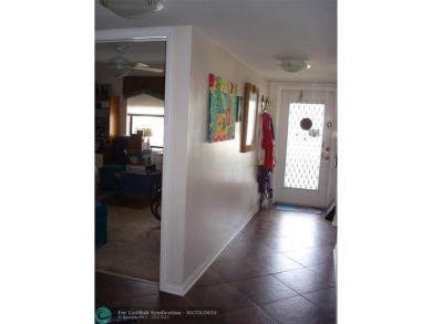 This 1st floor inside corner condo has an assigned parking spot on Sunrise Lakes Phase IV Golf Course in Florida - for sale on GolfHomes.com, golf home, golf lot