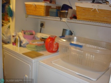 This 1st floor inside corner condo has an assigned parking spot on Sunrise Lakes Phase IV Golf Course in Florida - for sale on GolfHomes.com, golf home, golf lot