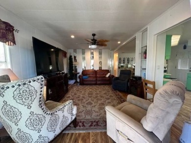 Turnkey 2-Bedroom, 2-Bath Home with Breathtaking Lake Views in on Vista Plantation Golf Club in Florida - for sale on GolfHomes.com, golf home, golf lot