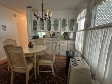 Turnkey 2-Bedroom, 2-Bath Home with Breathtaking Lake Views in on Vista Plantation Golf Club in Florida - for sale on GolfHomes.com, golf home, golf lot