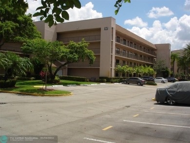 This 1st floor inside corner condo has an assigned parking spot on Sunrise Lakes Phase IV Golf Course in Florida - for sale on GolfHomes.com, golf home, golf lot