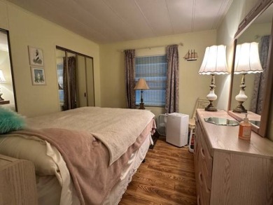 Turnkey 2-Bedroom, 2-Bath Home with Breathtaking Lake Views in on Vista Plantation Golf Club in Florida - for sale on GolfHomes.com, golf home, golf lot