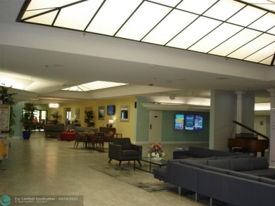 This 1st floor inside corner condo has an assigned parking spot on Sunrise Lakes Phase IV Golf Course in Florida - for sale on GolfHomes.com, golf home, golf lot