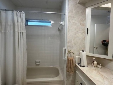 Turnkey 2-Bedroom, 2-Bath Home with Breathtaking Lake Views in on Vista Plantation Golf Club in Florida - for sale on GolfHomes.com, golf home, golf lot