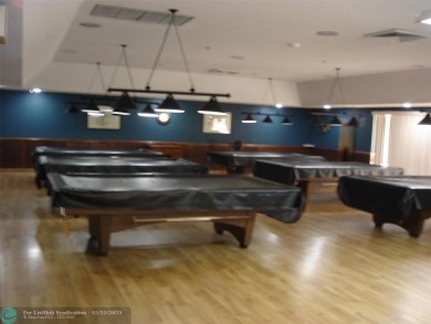 This 1st floor inside corner condo has an assigned parking spot on Sunrise Lakes Phase IV Golf Course in Florida - for sale on GolfHomes.com, golf home, golf lot