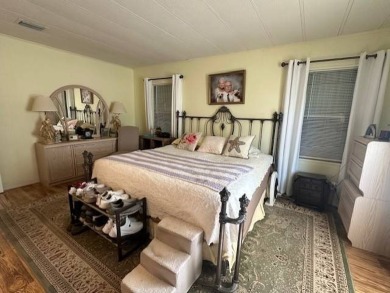 Turnkey 2-Bedroom, 2-Bath Home with Breathtaking Lake Views in on Vista Plantation Golf Club in Florida - for sale on GolfHomes.com, golf home, golf lot