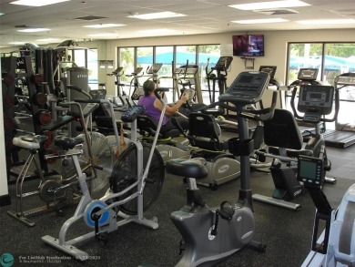 This 1st floor inside corner condo has an assigned parking spot on Sunrise Lakes Phase IV Golf Course in Florida - for sale on GolfHomes.com, golf home, golf lot