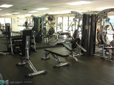 This 1st floor inside corner condo has an assigned parking spot on Sunrise Lakes Phase IV Golf Course in Florida - for sale on GolfHomes.com, golf home, golf lot
