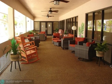 This 1st floor inside corner condo has an assigned parking spot on Sunrise Lakes Phase IV Golf Course in Florida - for sale on GolfHomes.com, golf home, golf lot