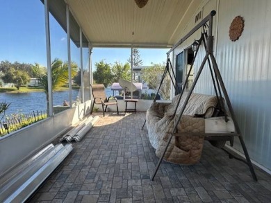 Turnkey 2-Bedroom, 2-Bath Home with Breathtaking Lake Views in on Vista Plantation Golf Club in Florida - for sale on GolfHomes.com, golf home, golf lot