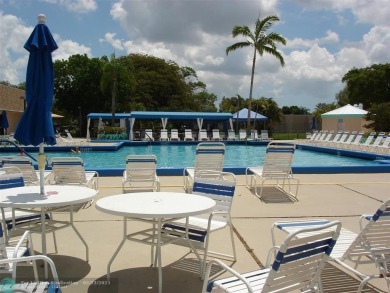 This 1st floor inside corner condo has an assigned parking spot on Sunrise Lakes Phase IV Golf Course in Florida - for sale on GolfHomes.com, golf home, golf lot