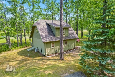 Nestled beside Hole 10 of Garland's scenic Fountains Course, 824 on Garland Resort and Golf Club  in Michigan - for sale on GolfHomes.com, golf home, golf lot