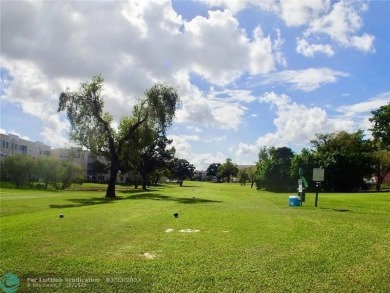 This 1st floor inside corner condo has an assigned parking spot on Sunrise Lakes Phase IV Golf Course in Florida - for sale on GolfHomes.com, golf home, golf lot