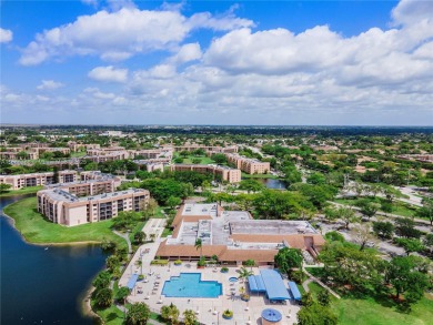 55+ Updated 2-bed/2-bath Condo W/ Full Impact Windows Front And on Sunrise Lakes Phase III in Florida - for sale on GolfHomes.com, golf home, golf lot