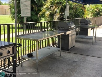 This 1st floor inside corner condo has an assigned parking spot on Sunrise Lakes Phase IV Golf Course in Florida - for sale on GolfHomes.com, golf home, golf lot