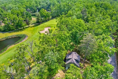 Nestled beside Hole 10 of Garland's scenic Fountains Course, 824 on Garland Resort and Golf Club  in Michigan - for sale on GolfHomes.com, golf home, golf lot