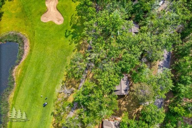 Nestled beside Hole 10 of Garland's scenic Fountains Course, 824 on Garland Resort and Golf Club  in Michigan - for sale on GolfHomes.com, golf home, golf lot