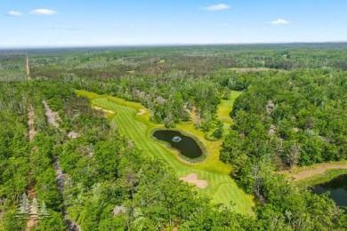 Nestled beside Hole 10 of Garland's scenic Fountains Course, 824 on Garland Resort and Golf Club  in Michigan - for sale on GolfHomes.com, golf home, golf lot