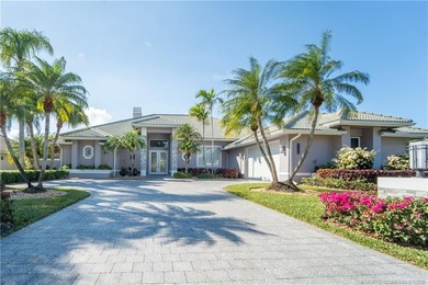 This stunning home, complete with impact windows and door and on Hobe Sound Golf Club in Florida - for sale on GolfHomes.com, golf home, golf lot