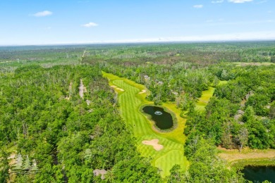 Nestled beside Hole 10 of Garland's scenic Fountains Course, 824 on Garland Resort and Golf Club  in Michigan - for sale on GolfHomes.com, golf home, golf lot