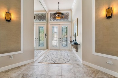 This stunning home, complete with impact windows and door and on Hobe Sound Golf Club in Florida - for sale on GolfHomes.com, golf home, golf lot