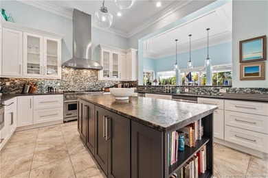 This stunning home, complete with impact windows and door and on Hobe Sound Golf Club in Florida - for sale on GolfHomes.com, golf home, golf lot