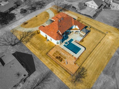 This breathtaking 4-bedroom, 3.5-bathroom, 3,953 sq. ft. home in on Shawnee Country Club in Oklahoma - for sale on GolfHomes.com, golf home, golf lot