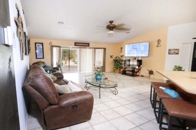 Welcome to this charming and move-in-ready 3-bedroom, 2-bathroom on Las Barrancas Golf Course in Arizona - for sale on GolfHomes.com, golf home, golf lot