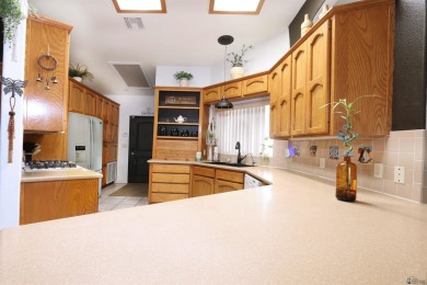 Welcome to this charming and move-in-ready 3-bedroom, 2-bathroom on Las Barrancas Golf Course in Arizona - for sale on GolfHomes.com, golf home, golf lot