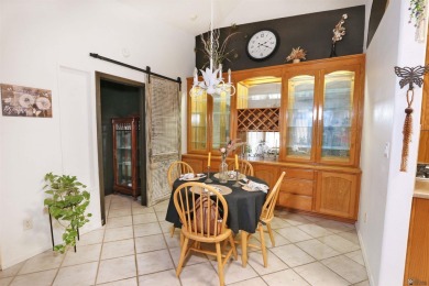 Welcome to this charming and move-in-ready 3-bedroom, 2-bathroom on Las Barrancas Golf Course in Arizona - for sale on GolfHomes.com, golf home, golf lot