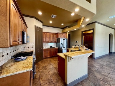 This spacious 2-story custom pool home in the gated Los Lagos on Los Lagos Golf Club in Arizona - for sale on GolfHomes.com, golf home, golf lot